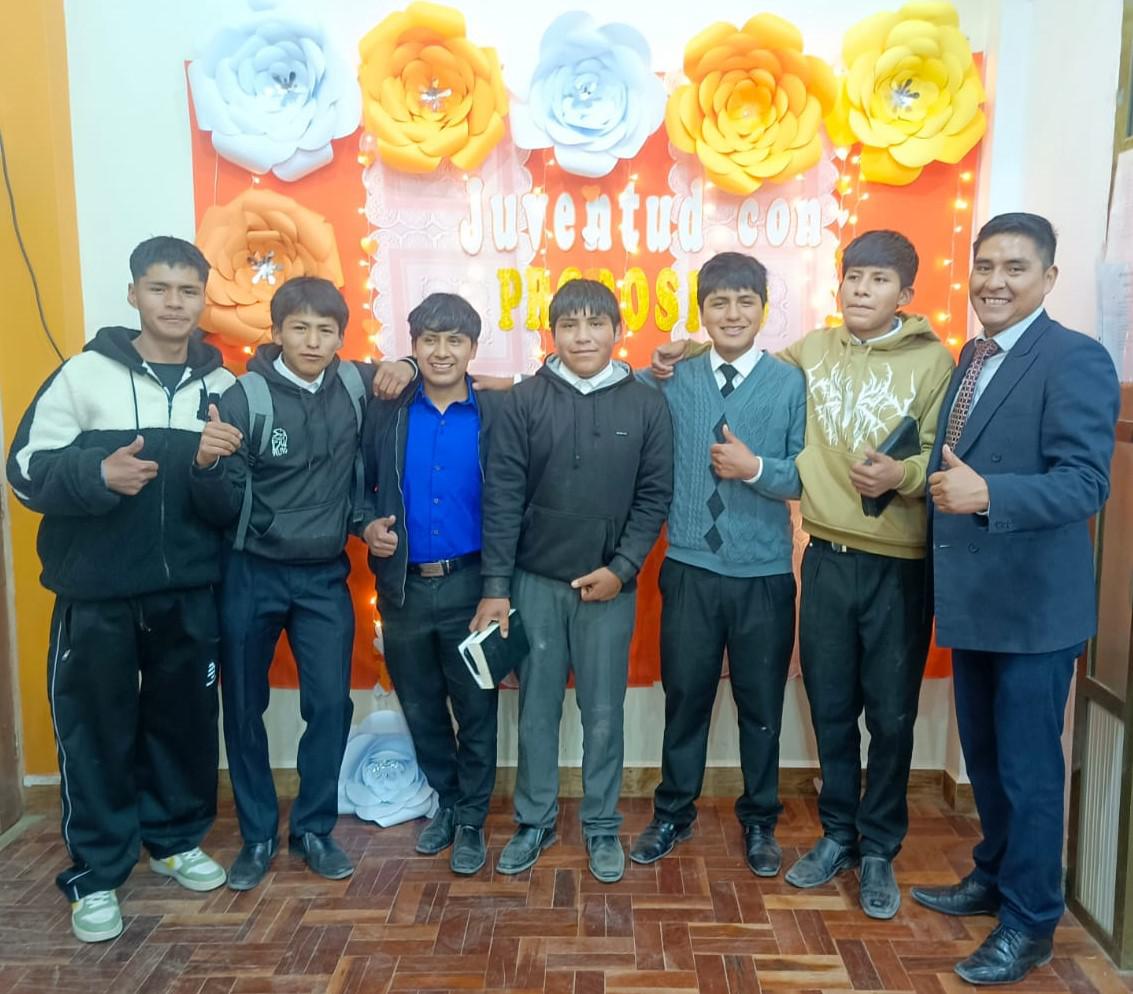 Tutor and youth taking a memory photo.