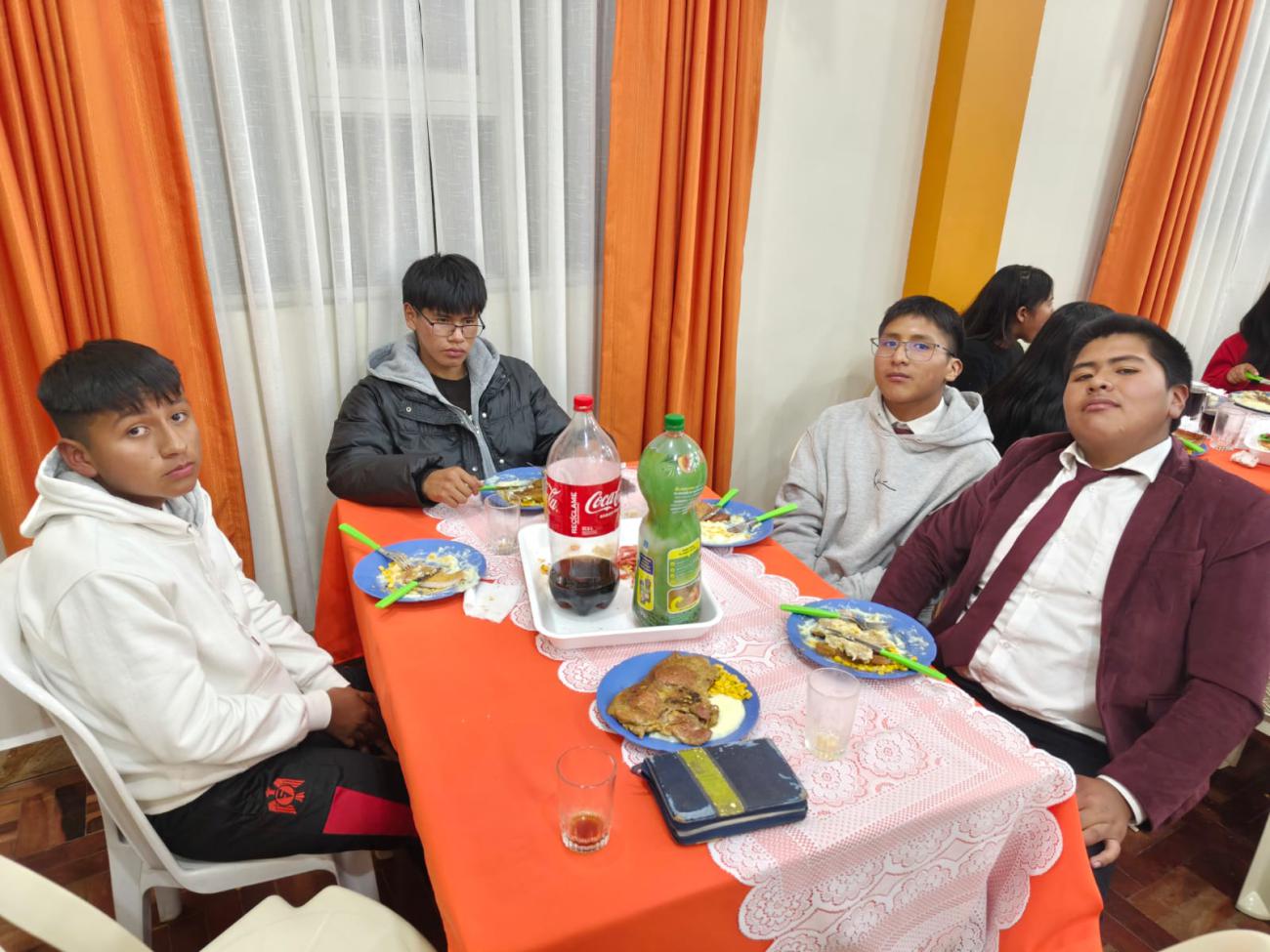 Young people about to taste the dinner.