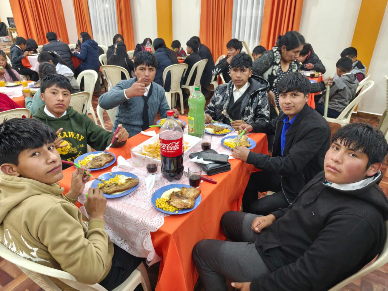 Young people enjoying the dinner prepared by the foundation.