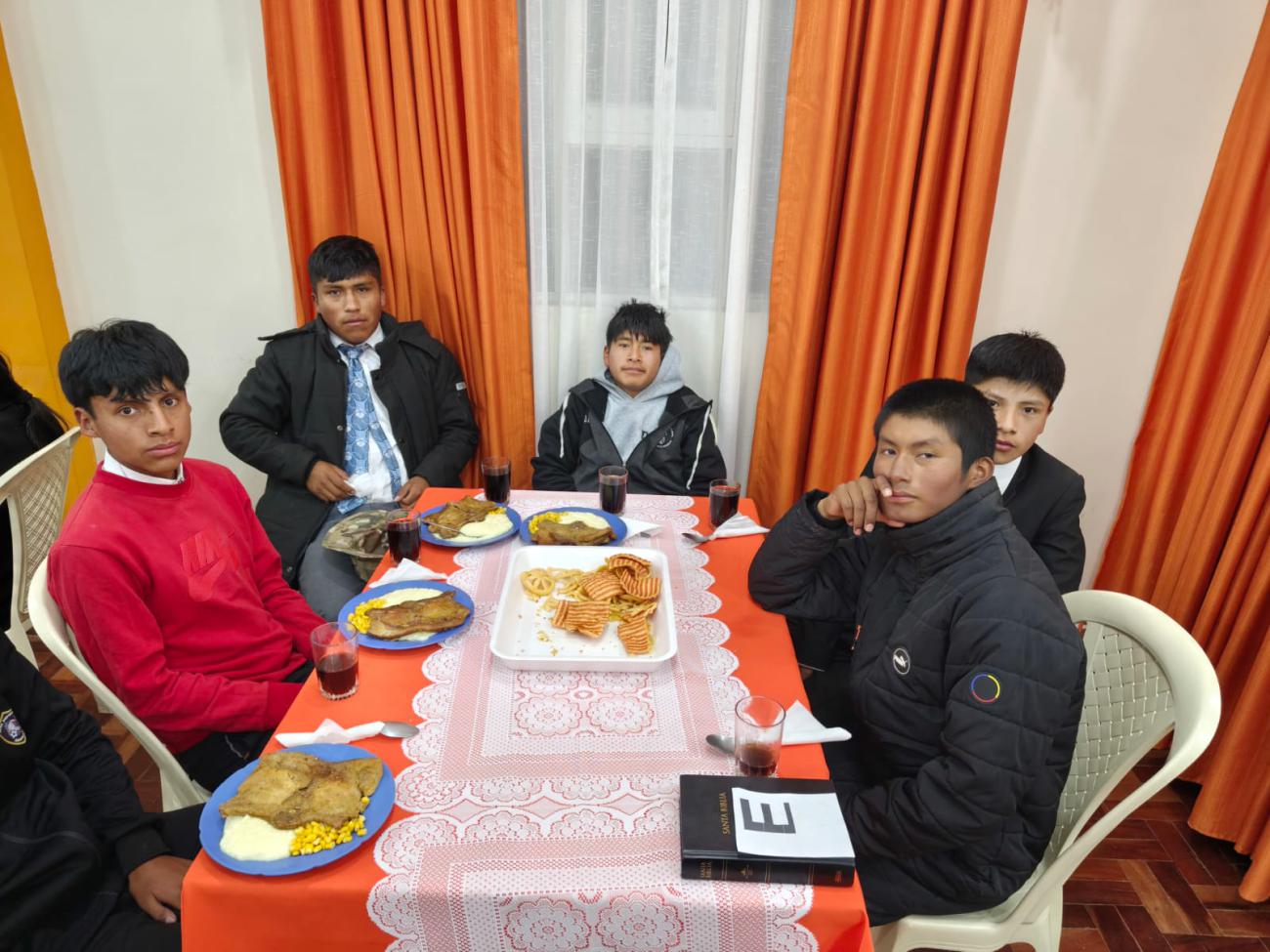 Young people about to taste the dinner.