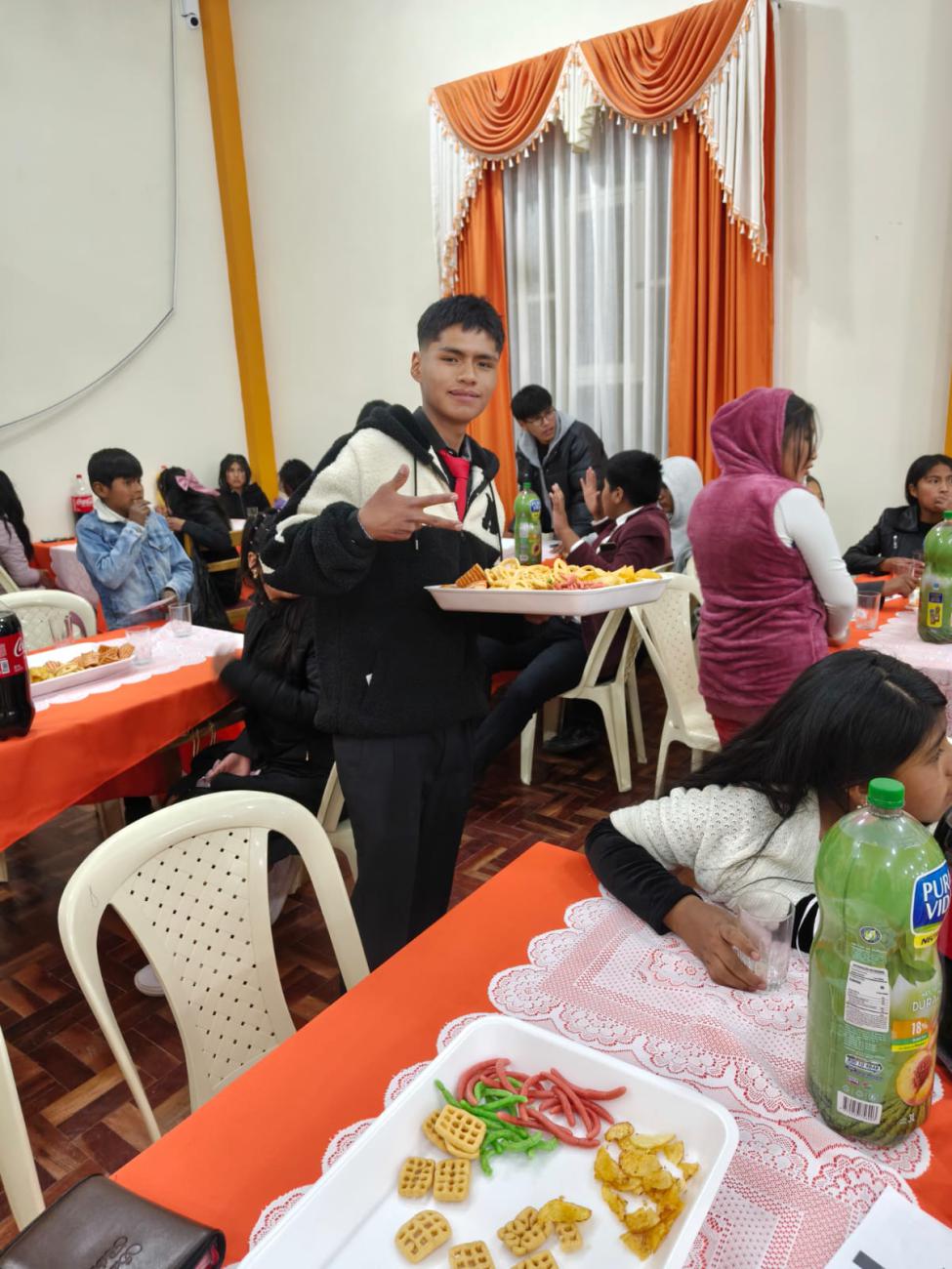 Helpful young volunteer assisting with snacks.